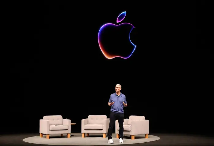 Tim Cook describes Apple’s AI as Apple Intelligence and notes that the company made a user-driven decision.