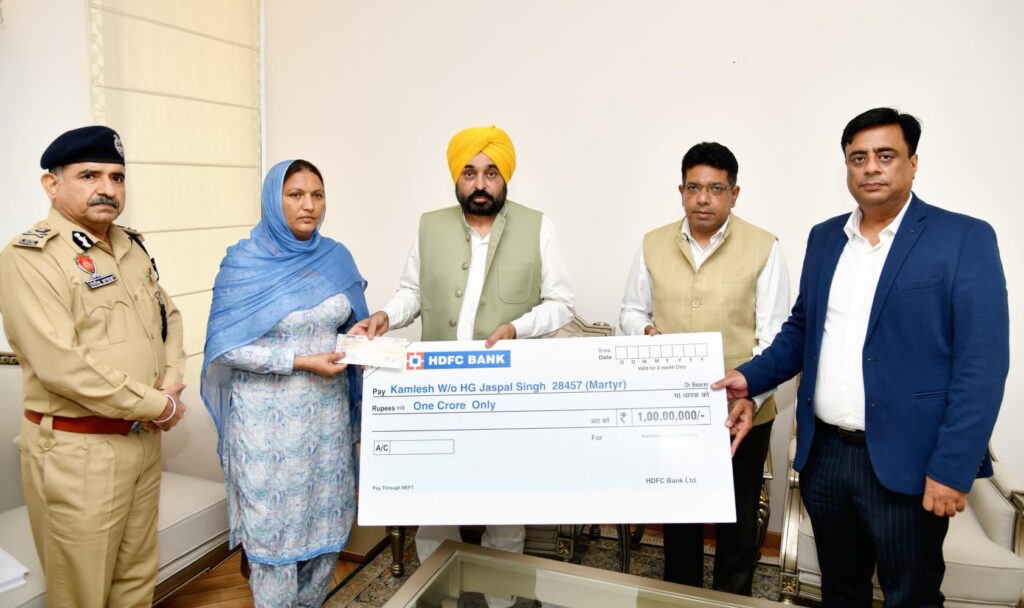 CM Bhagwant Mann hands over cheque of insurance worth Rs 1 crore to family of martyred Home Guard Jawan Jaspal Singh